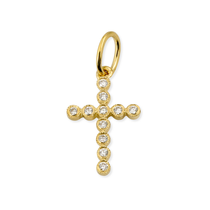 A 14K gold petite bezel diamond cross pendant with natural diamonds encircling the perimeter of the cross.