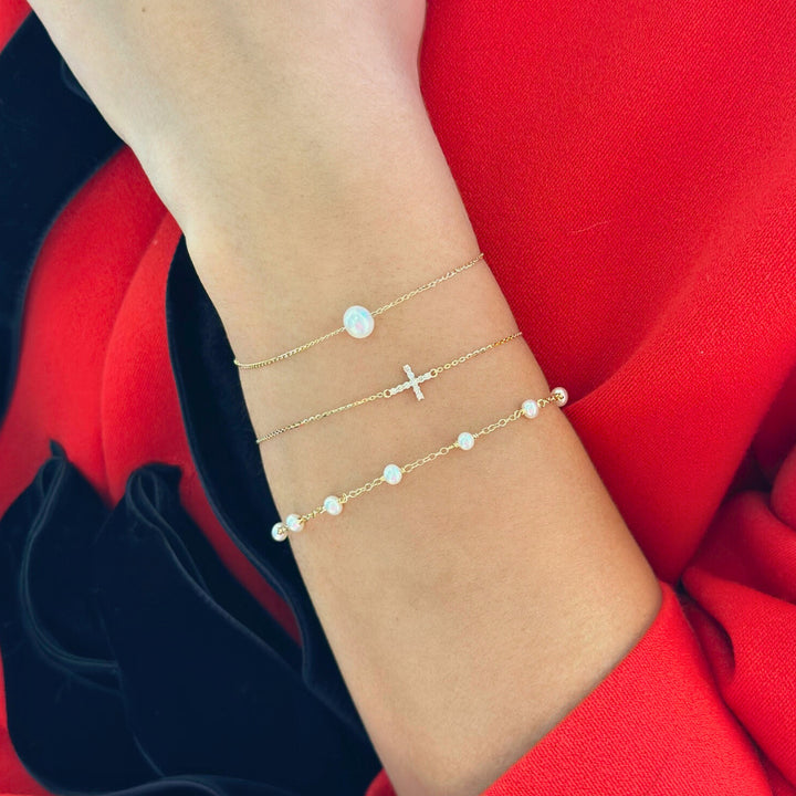 14K 1/10 CTW Natural Diamond Sideways Cross Bracelet On Model-Embark Fine Jewelry