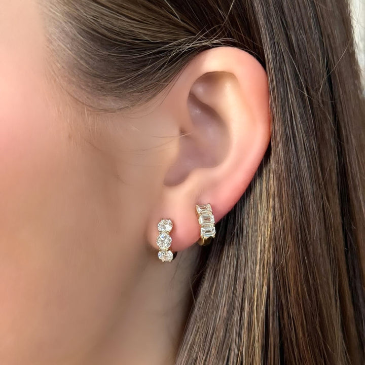 14K 3-Stone and Emerald-Cut Shared Prong Huggies ear stack-Embark Fine Jewelry