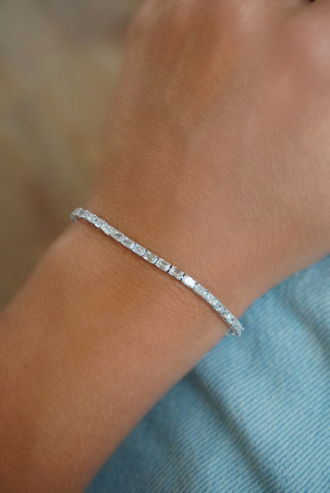 14KW 5.39 CTW Lab Grown Emerald-Cut Diamond Line Bracelet On Model-Embark Fine Jewelry