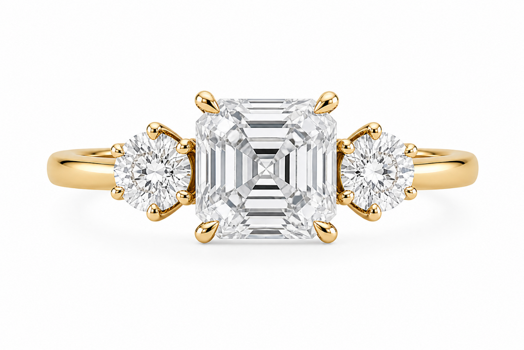 Adelaide 14K yellow gold engagement ring with an Asscher center diamond and round side stones.