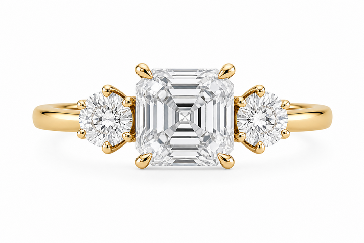 Adelaide 14K yellow gold engagement ring with an Asscher center diamond and round side stones.