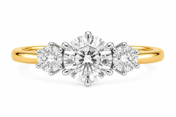 Adelaide 14K yellow gold three-stone engagement ring with a large round center diamond and two smaller round side diamonds.