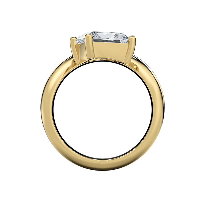 Caroline engagement ring: classic gold band with an off-set pear-shape diamond center.