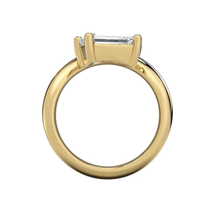 Caroline engagement ring: gold band with an off-set pear-shape diamond center.