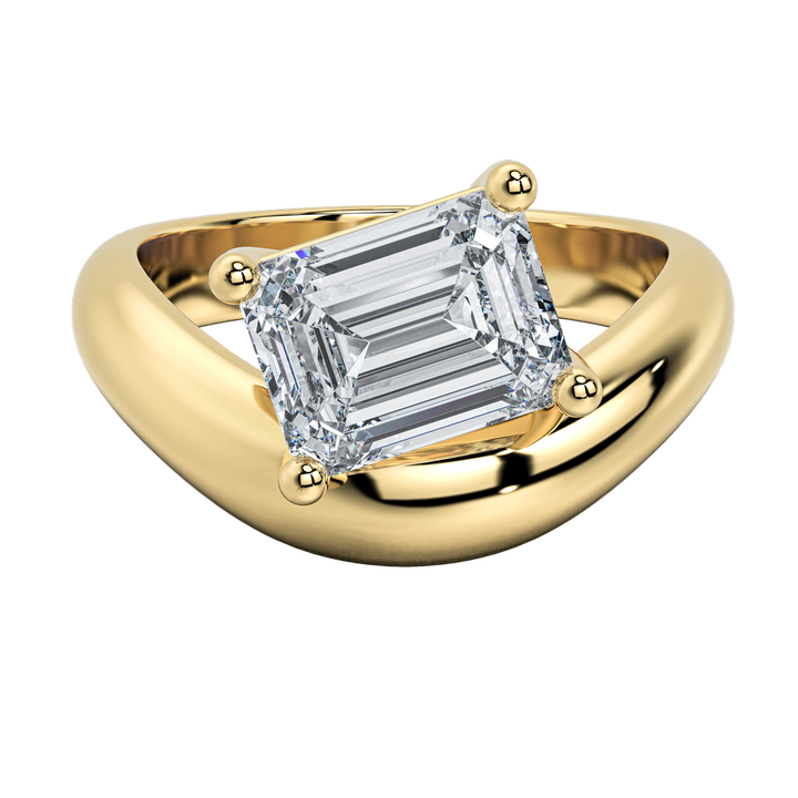 Caroline Signature Engagement Ring: 14K yellow gold band with a sculptural curve, featuring an emerald cut diamond.