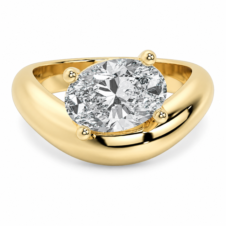 Caroline Signature Engagement Style: 14K yellow gold ring with a sculptural band and oval diamond.