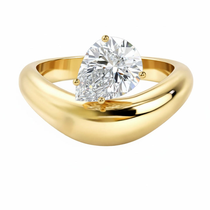 Caroline Signature engagement ring with a pear-shaped diamond in 14K yellow gold.