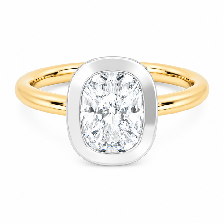 Celeste two-tone 14K yellow and white gold bezel engagement ring with cushion diamond.