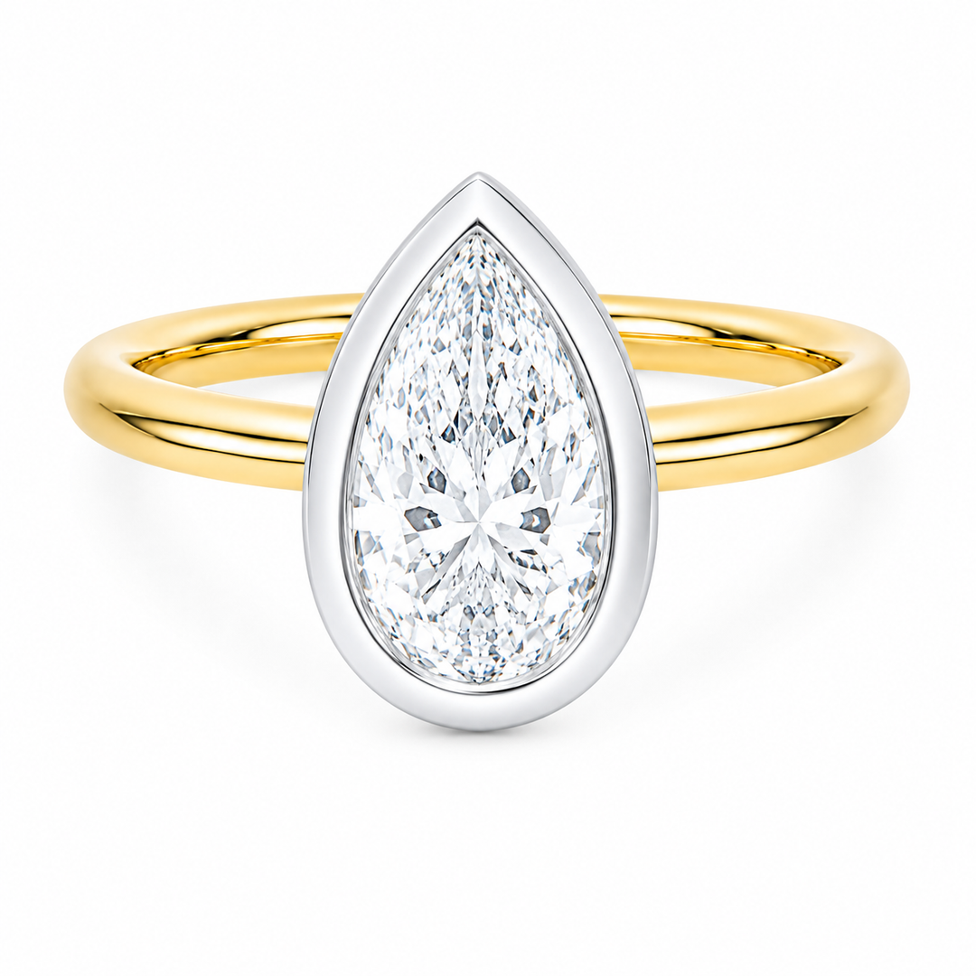 Celeste two-tone 14K yellow and white gold engagement ring with a pear-shaped diamond.