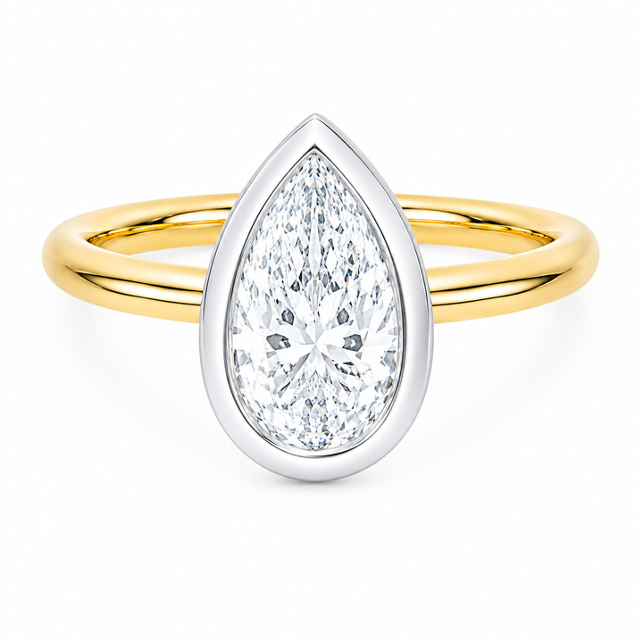 Celeste two-tone 14K yellow and white gold engagement ring with a pear-shaped diamond.