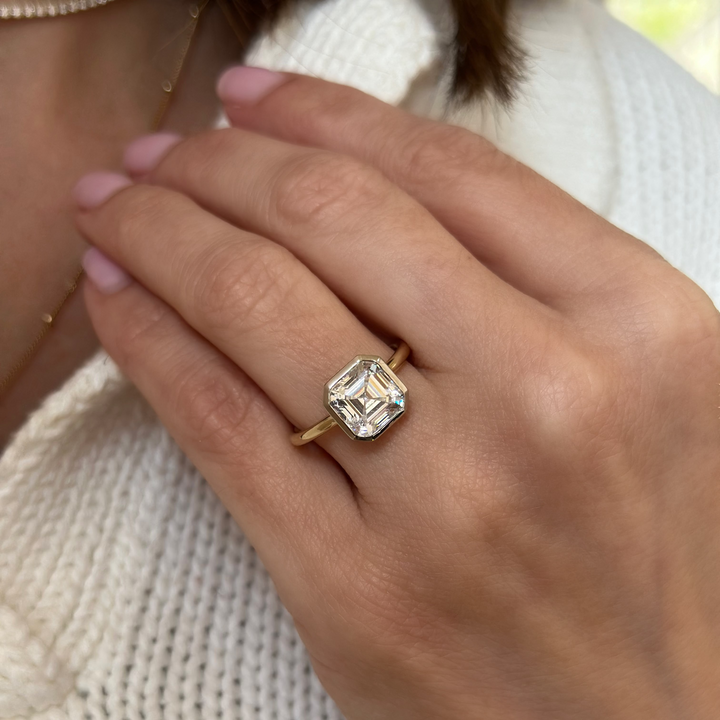 Celeste 14K yellow and white gold engagement ring with a geometric bezel and 2 CT diamond.