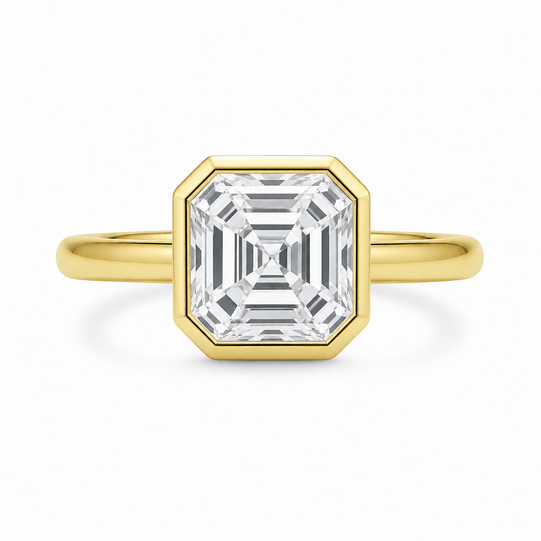 Celine 14K yellow gold engagement ring with a bezel-set Asscher cut diamond.