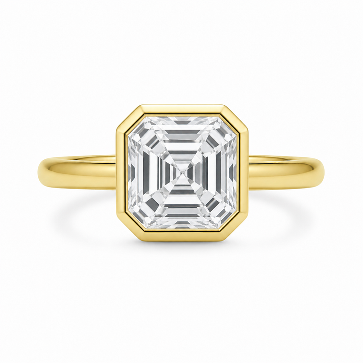 Celine 14K yellow gold engagement ring with a bezel-set Asscher cut diamond.