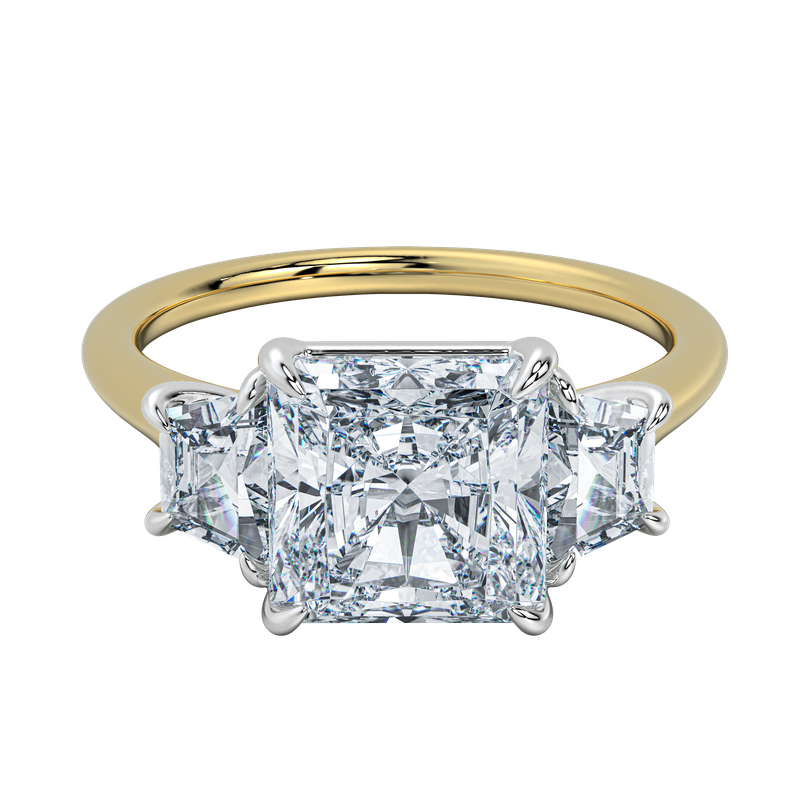 Charlotte engagement ring: gold band, emerald cut center diamond, trapezoid side stones.