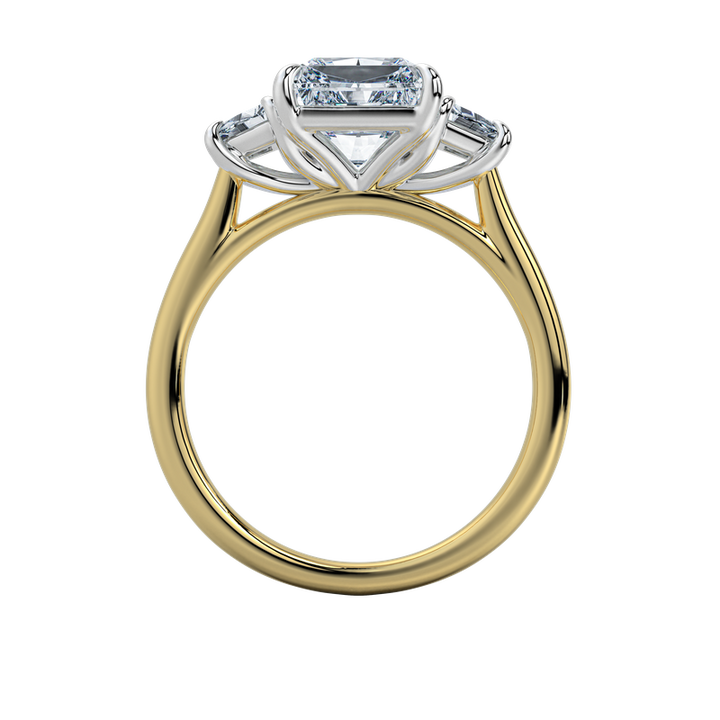 Charlotte engagement ring: gold band, emerald-cut center stone, trapezoid side stones.
