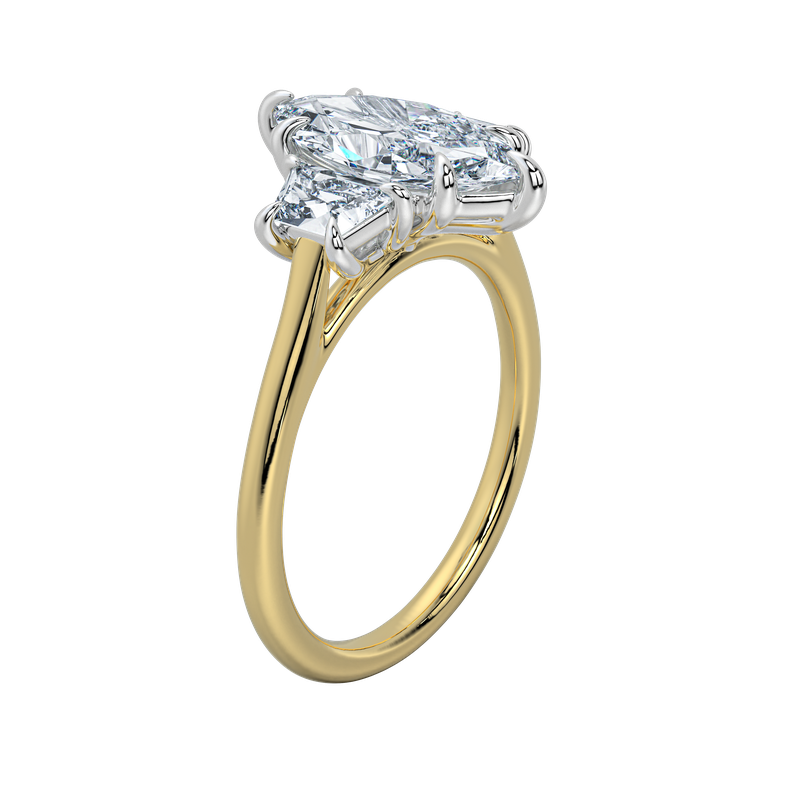 Charlotte engagement ring with an emerald center stone and trapezoid side stones on a yellow gold band.