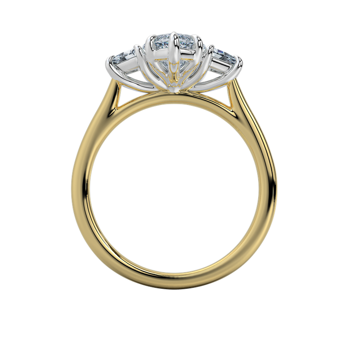 Charlotte engagement ring with an emerald center stone and trapezoid side stones on a yellow gold band.