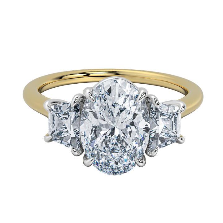 Charlotte engagement ring with oval center diamond and trapezoid side stones on a yellow gold band.