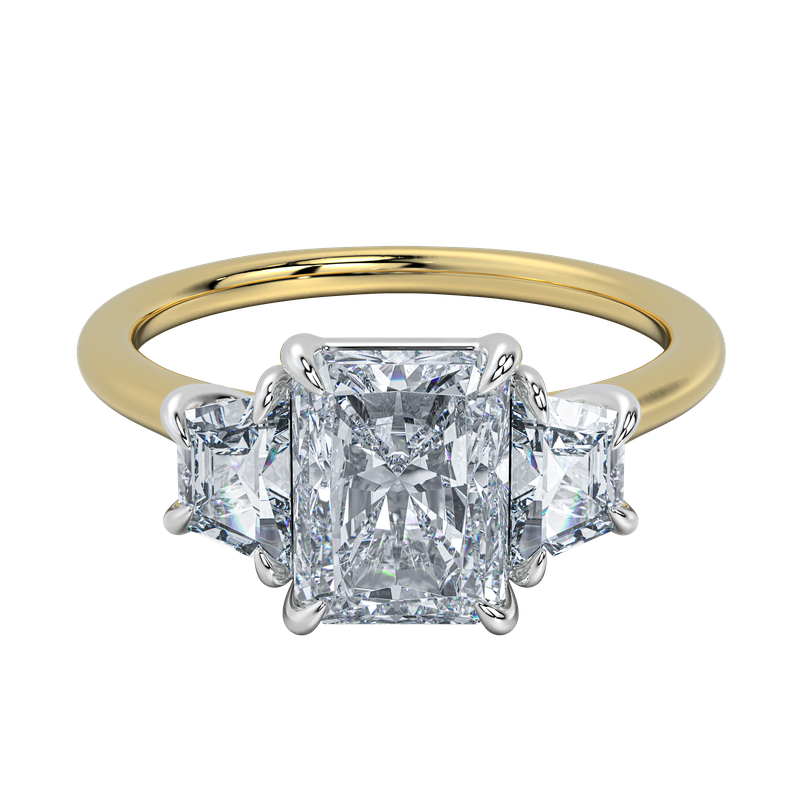 Charlotte engagement ring with radiant center diamond and trapezoid side stones on a yellow gold band.