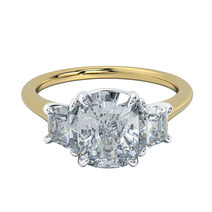 Charlotte engagement ring with a cushion-cut diamond center and trapezoid side stones on a yellow gold band.