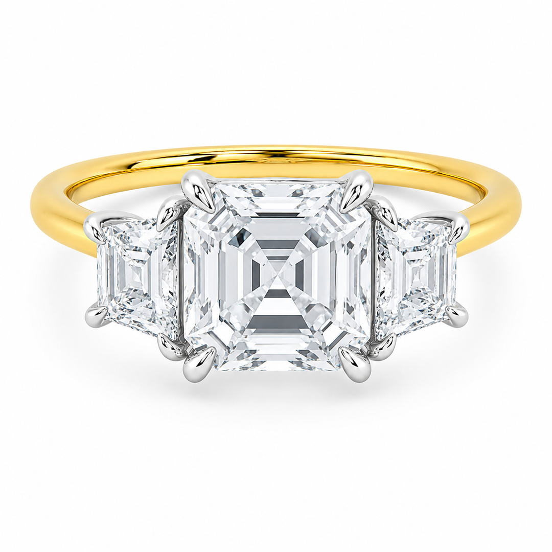 Charlotte three-stone engagement ring with Asscher center, trapezoid side diamonds, and two-tone 14K yellow and white gold.