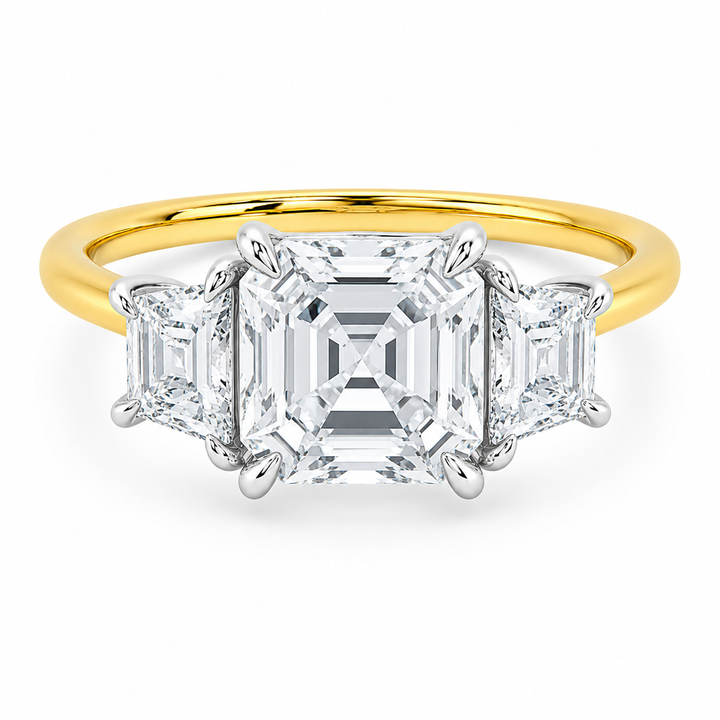Charlotte three-stone engagement ring with Asscher center, trapezoid side diamonds, and two-tone 14K yellow and white gold.