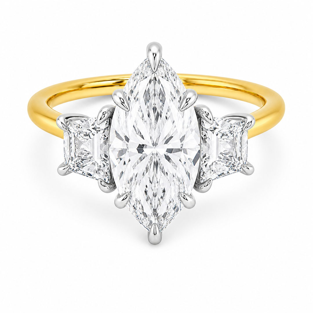 Charlotte three-stone engagement ring with a marquise center diamond, trapezoid side stones, and a two-tone yellow and white gold setting.