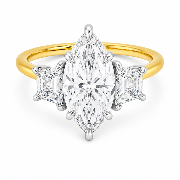 Charlotte three-stone engagement ring with a marquise center diamond, trapezoid side stones, and a two-tone yellow and white gold setting.