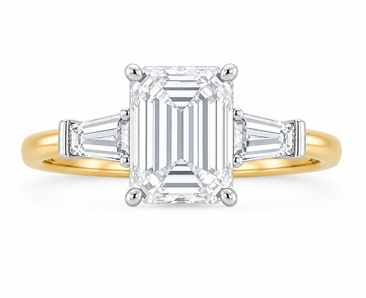 Colette engagement ring: 14K yellow gold band, white gold setting, emerald cut center diamond, tapered baguette side stones.