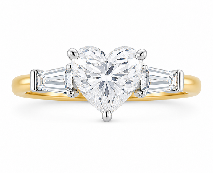 Colette Signature engagement ring with a heart-shaped diamond, tapered baguette side stones, and a two-tone 14K yellow and white gold band.