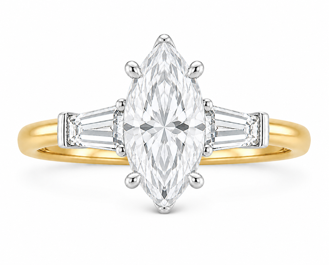 Colette Signature engagement ring with a marquise diamond, tapered baguette side stones, and a two-tone 14K yellow gold band.