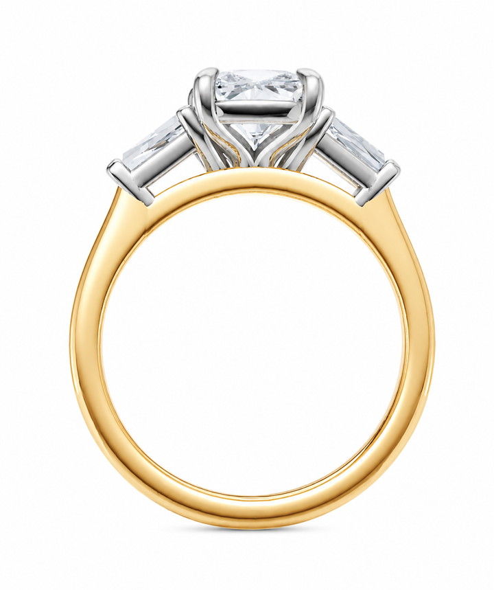 Colette two-tone engagement ring with a radiant cut center diamond and tapered baguette side stones.