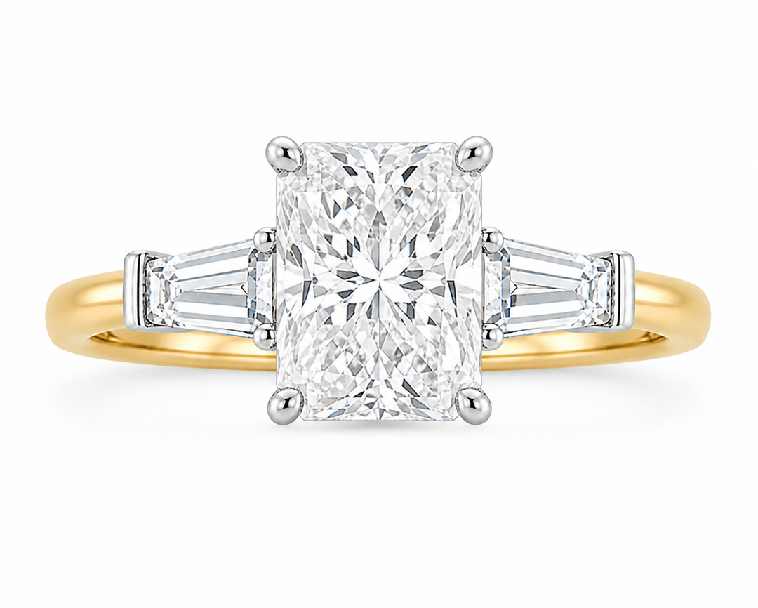 Colette Signature Engagement Style: Radiant cut diamond with tapered baguette side stones on a two-tone 14K gold band.