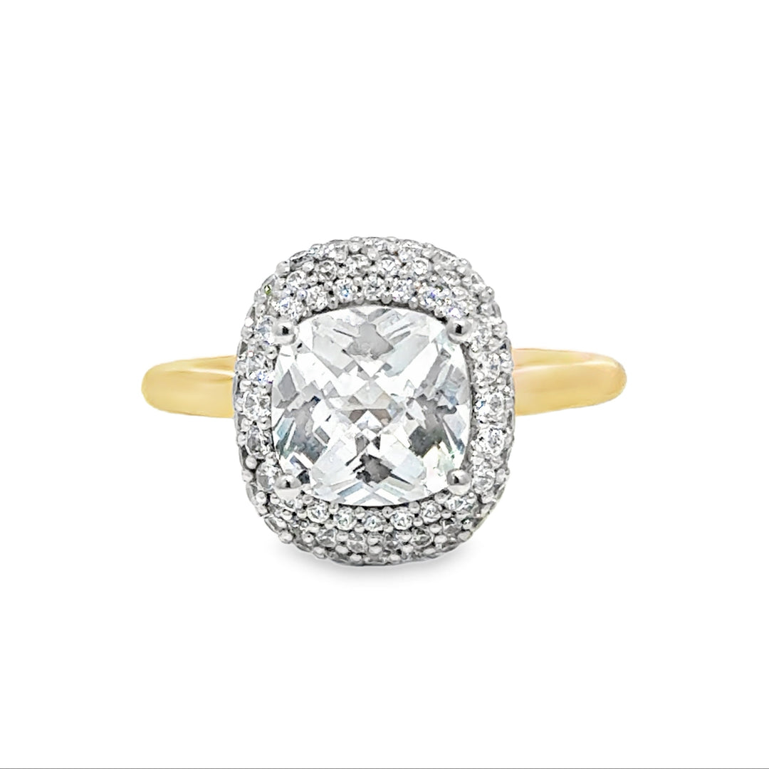 Eleanor UNBRIDALED engagement ring with a cushion-cut center diamond, pavé halo, and yellow gold band.