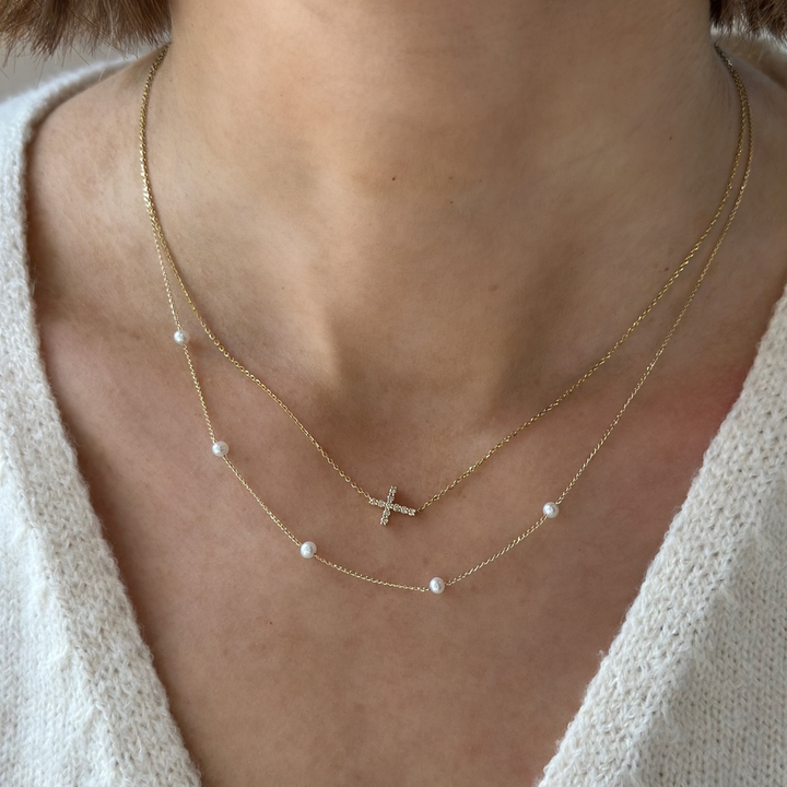 14K 1/10 CTW Natural Diamond Sideways Cross Necklace
