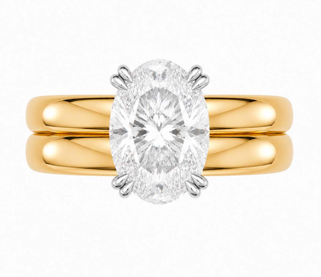 Frankie Signature engagement ring with an oval diamond on a 14K yellow gold double dome band.