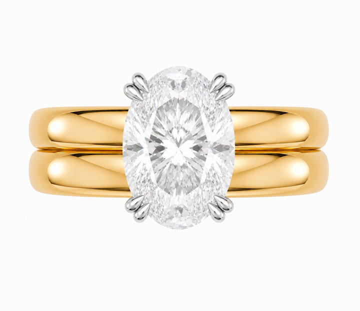 Frankie Signature engagement ring with an oval diamond on a 14K yellow gold double dome band.