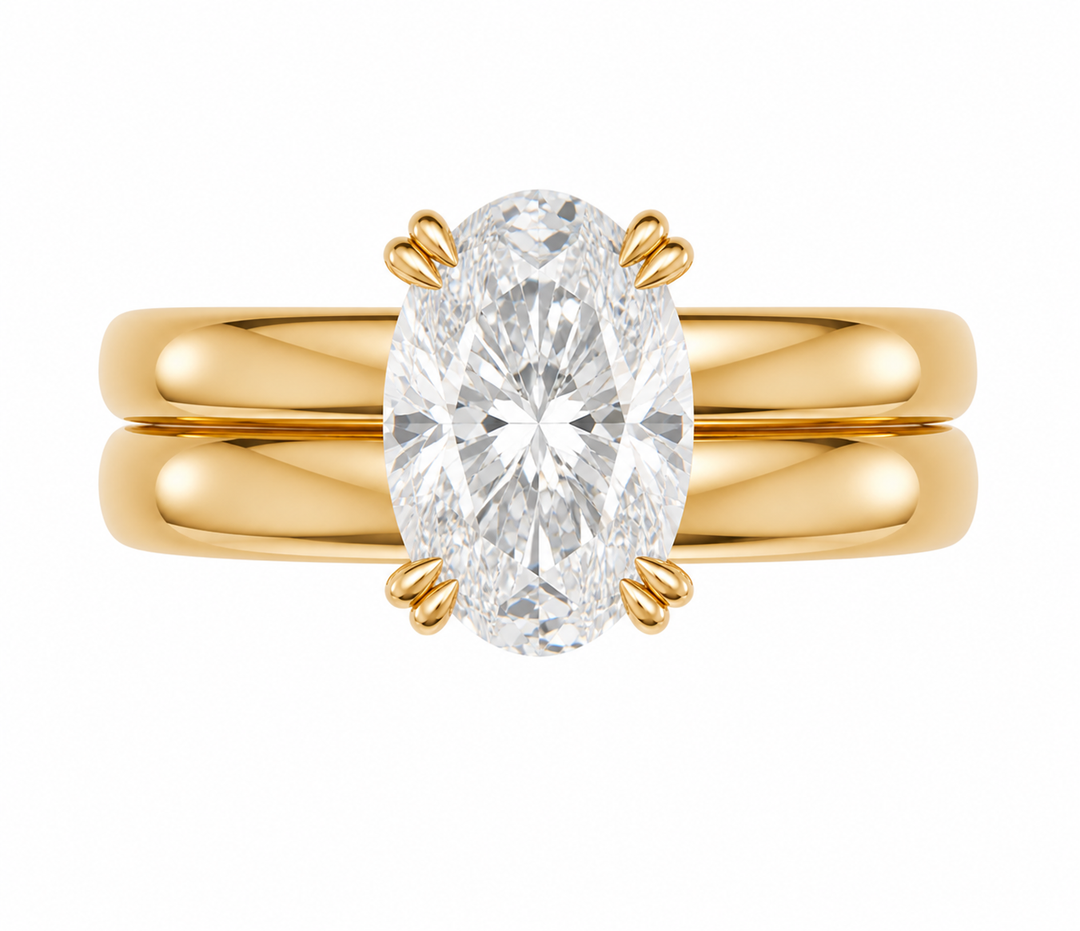 Frankie Signature engagement ring with an oval diamond on a 14K yellow gold double dome band.