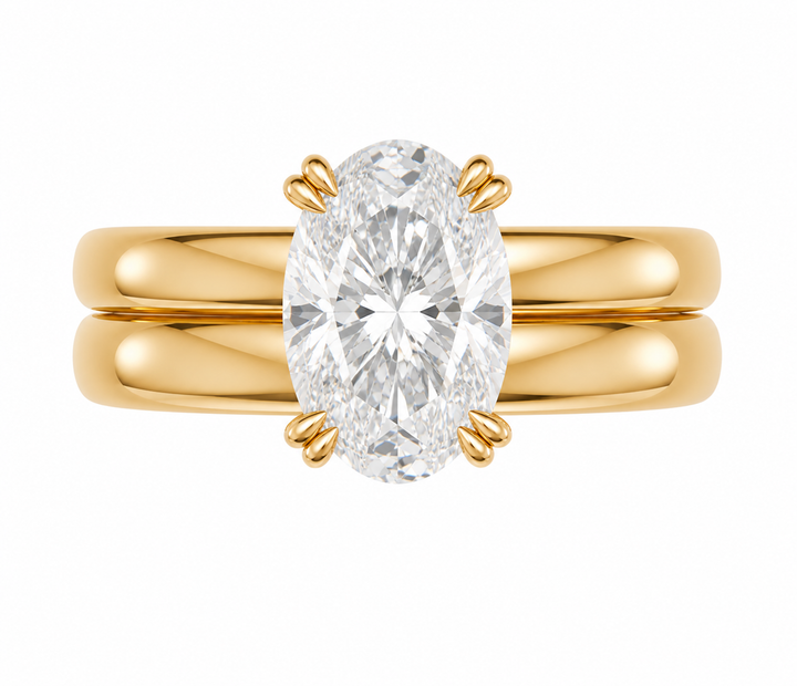 Frankie Signature engagement ring with an oval diamond on a 14K yellow gold double dome band.