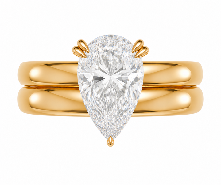 Frankie Signature Engagement Style: 14K yellow gold double dome band with a pear-shaped solitaire diamond.