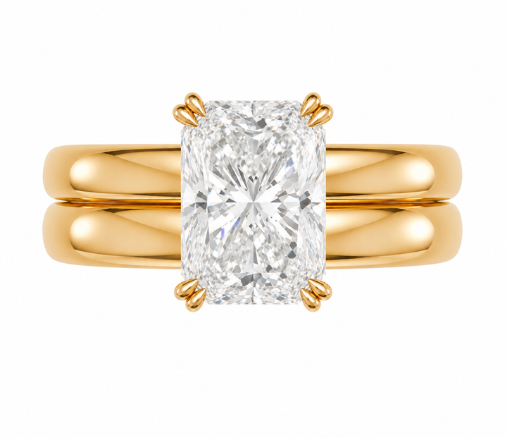 Frankie Signature engagement ring with a radiant cut diamond on a 14K yellow gold double dome band.