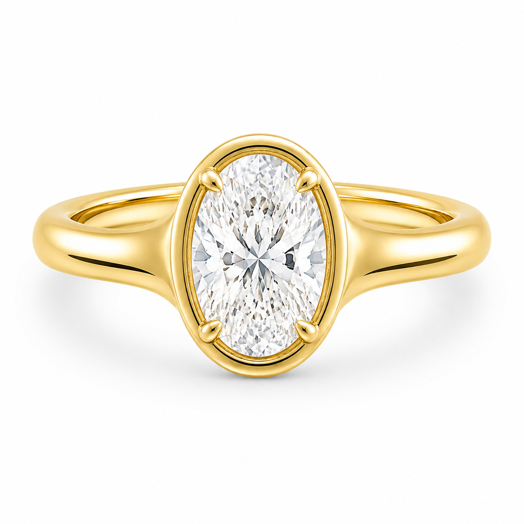 Goldie Signature 14K yellow gold engagement ring with an oval diamond and claw prongs.