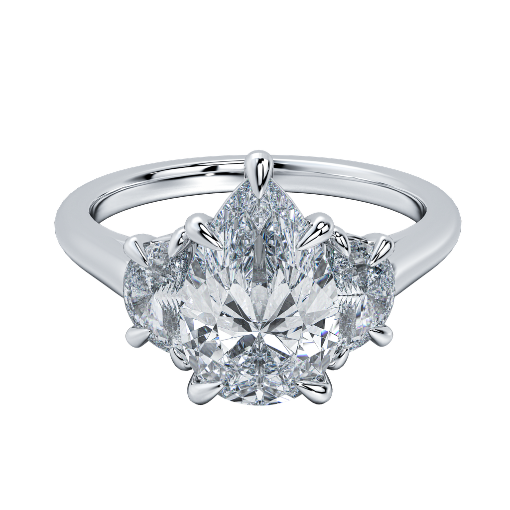 Hailey engagement ring with a large pear-cut diamond flanked by two smaller pear-cut diamonds on a delicate gold band.