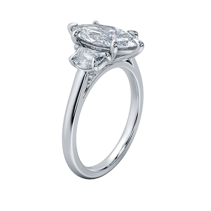 Hailey engagement ring with an oval-cut center diamond and two smaller side diamonds on a delicate gold band.