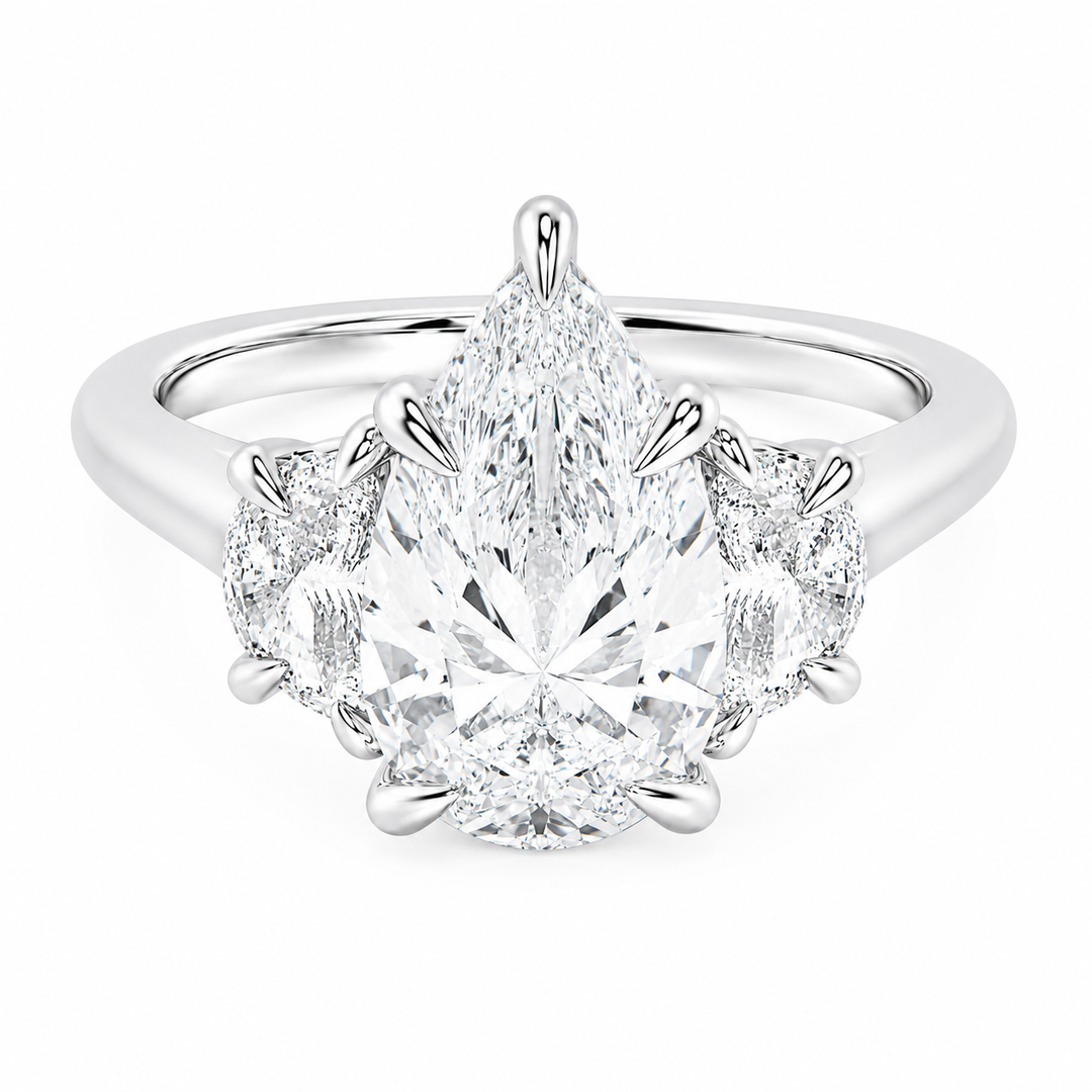 Hailey Signature 14K white gold engagement ring with a pear-shaped center diamond and half-moon side stones.