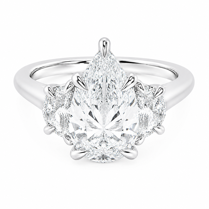 Hailey Signature 14K white gold engagement ring with a pear-shaped center diamond and half-moon side stones.