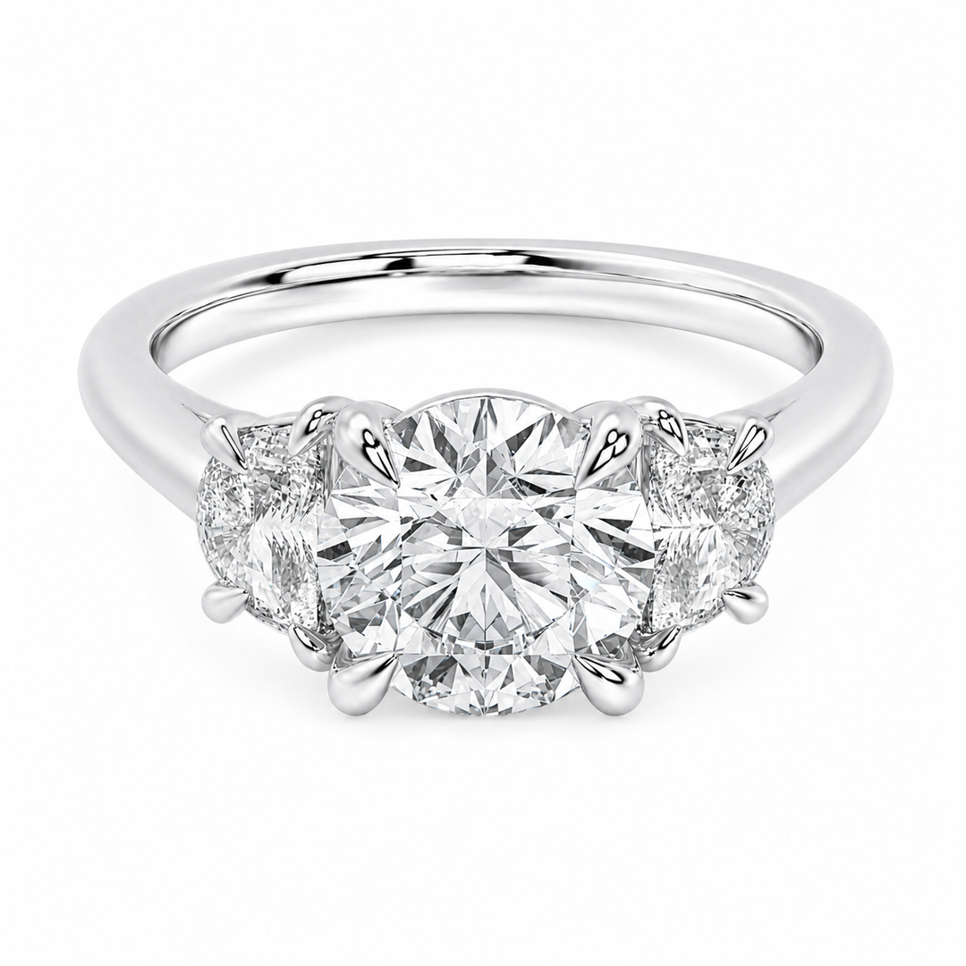 Hailey Signature 14K white gold engagement ring with a round center diamond and half moon side stones.