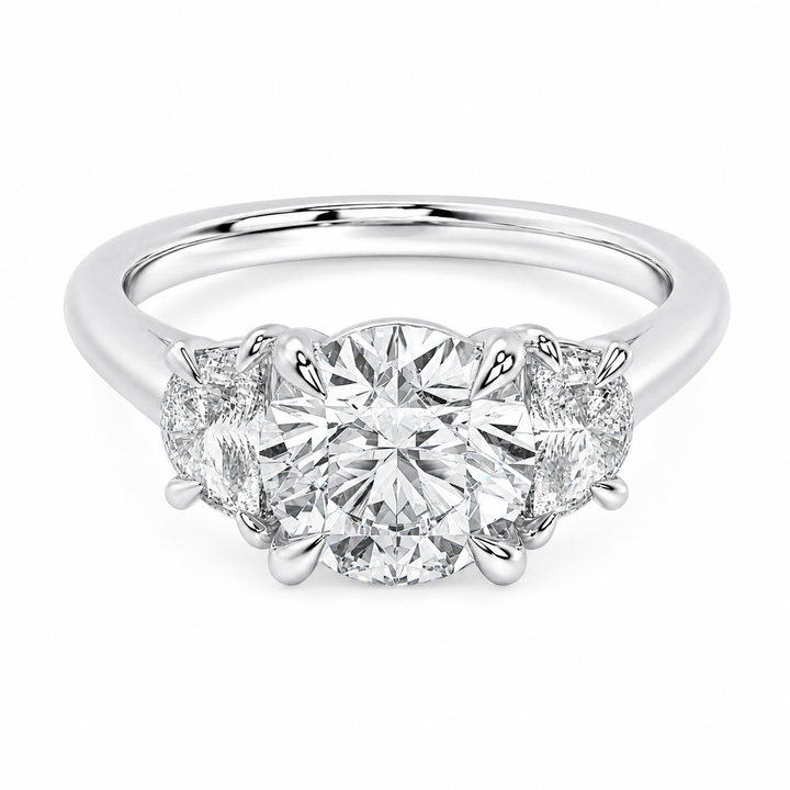 Hailey Signature 14K white gold engagement ring with a round center diamond and half moon side stones.