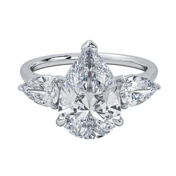 White gold engagement ring with a large pear-shaped center diamond flanked by two smaller pear diamonds.